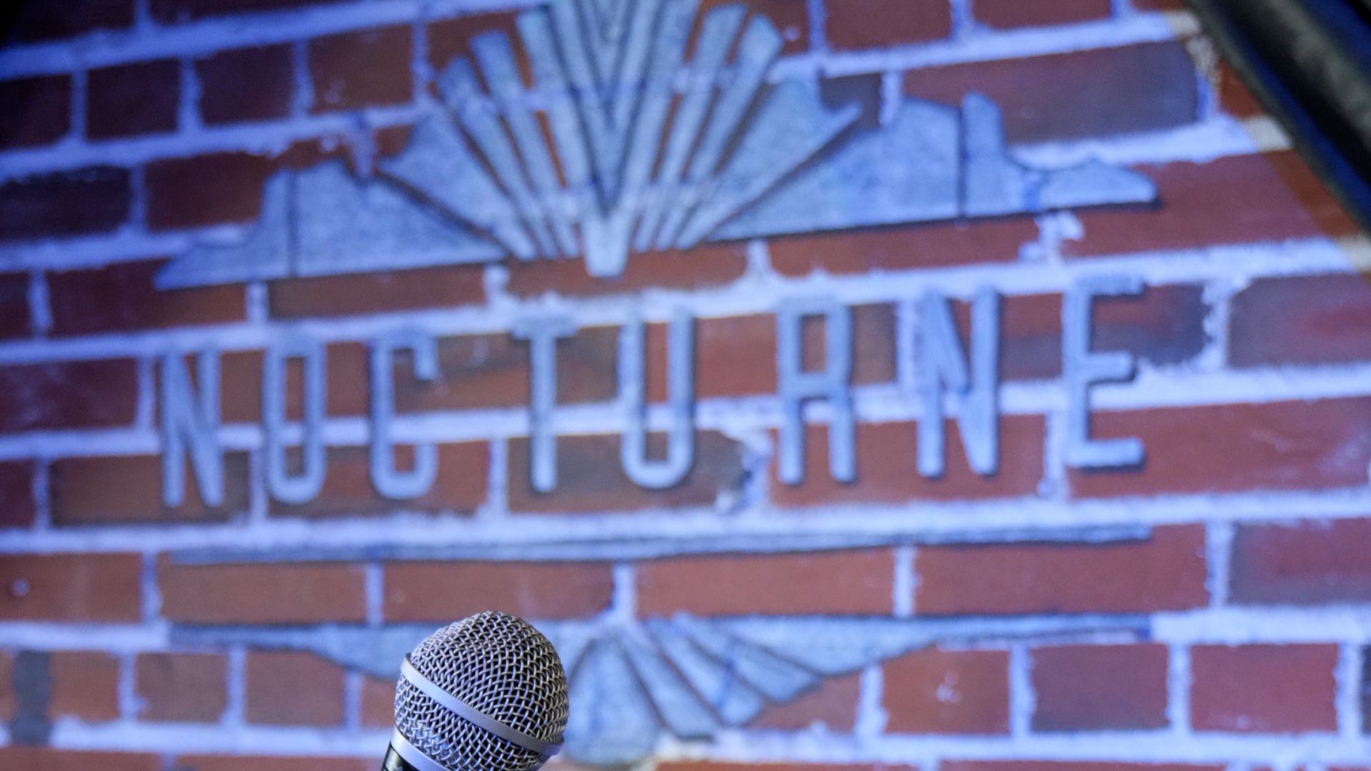 A Microphone On A Brick Wall