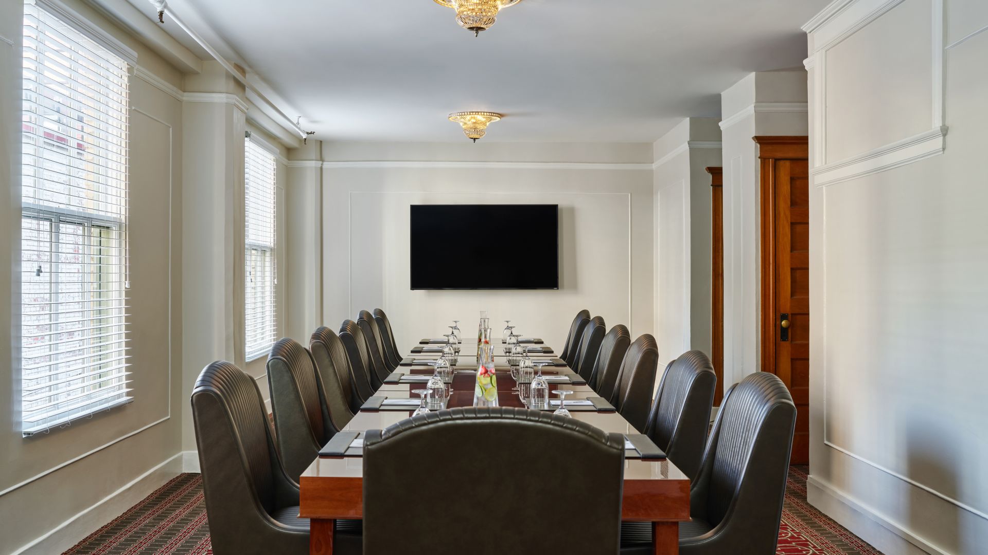 Hamilton Meeting Room at The Oxford Hotel - Long Board Room Table with Plush Leather Conference Chairs